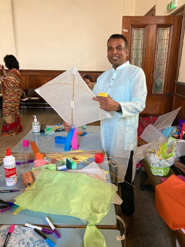 Adult holding kite