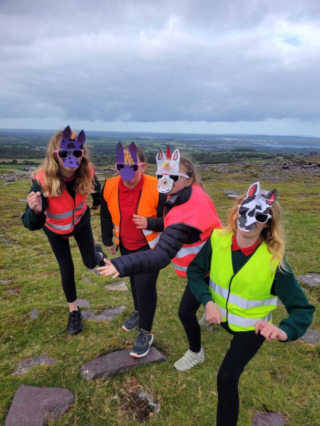 children wearing masks they have made